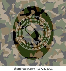 pill icon inside camouflage emblem