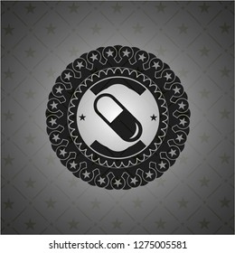 pill icon inside dark badge