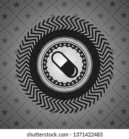pill icon inside dark emblem