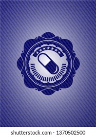 pill icon inside denim background