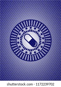 pill icon inside emblem with denim high quality background