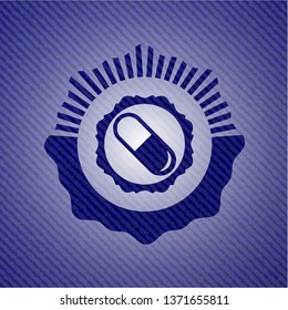 pill icon inside emblem with denim high quality background