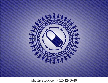 pill icon inside emblem with jean background
