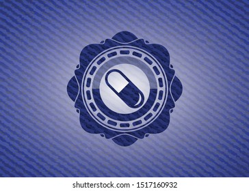 pill icon inside emblem with jean background