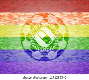 pill icon inside emblem on mosaic background with the colors of the LGBT flag