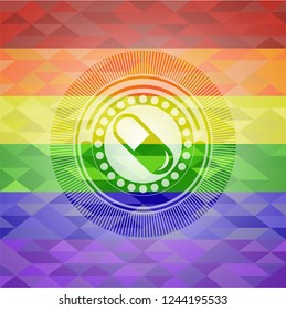 pill icon inside emblem on mosaic background with the colors of the LGBT flag