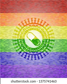 pill icon inside emblem on mosaic background with the colors of the LGBT flag