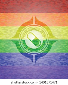 pill icon inside emblem on mosaic background with the colors of the LGBT flag