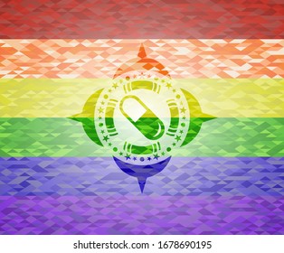 pill icon inside emblem on mosaic background with the colors of the LGBT flag
