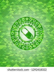 pill icon inside green emblem. Mosaic background