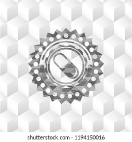 pill icon inside grey badge with geometric cube white background