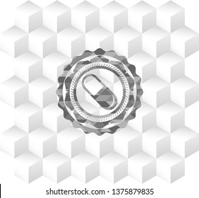 pill icon inside grey badge with geometric cube white background