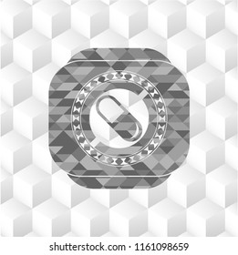pill icon inside grey icon or emblem with geometric cube white background