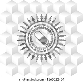 pill icon inside grey emblem with geometric cube white background