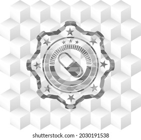 pill icon inside grey emblem with cube white background. 