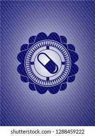 pill icon inside jean or denim emblem or badge background