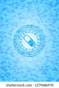 pill icon inside light blue mosaic emblem