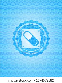 pill icon inside light blue water wave emblem.