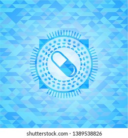 pill icon inside light blue mosaic emblem