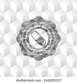 pill icon inside realistic grey emblem with geometric cube white background. 