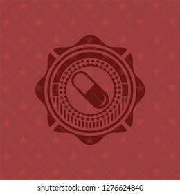 pill icon inside realistic red emblem