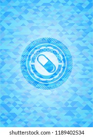 pill icon inside realistic sky blue emblem. Mosaic background