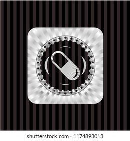 pill icon inside silver shiny emblem