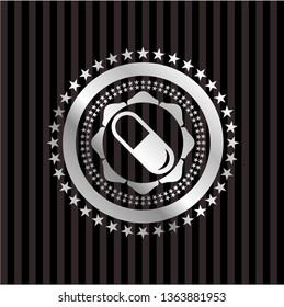 pill icon inside silvery emblem or badge