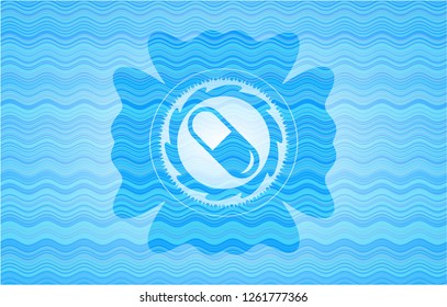 pill icon inside sky blue water emblem.