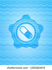 pill icon inside water wave style badge.