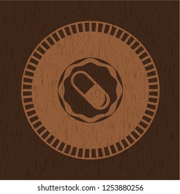 pill icon inside wood emblem
