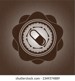 pill icon inside wooden emblem. Vintage.