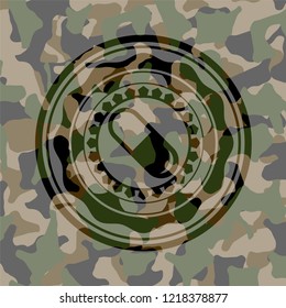 pill icon on camo pattern