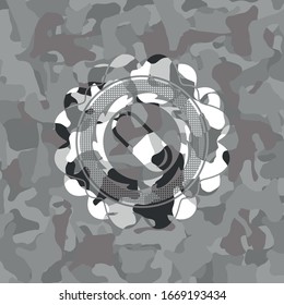 pill icon on grey camo texture
