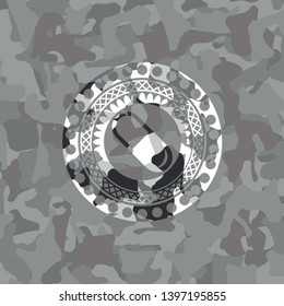 pill icon on grey camouflaged pattern