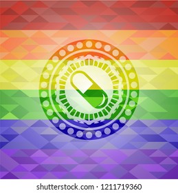 pill icon on mosaic background with the colors of the LGBT flag