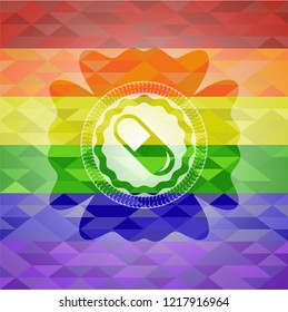 pill icon on mosaic background with the colors of the LGBT flag