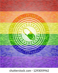 pill icon on mosaic background with the colors of the LGBT flag