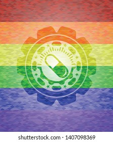 pill icon on mosaic background with the colors of the LGBT flag