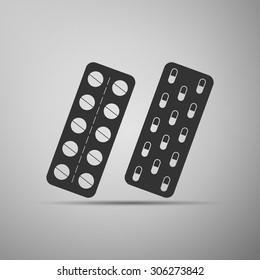 Pills in a blister pack icon on grey background. Vector Illustration