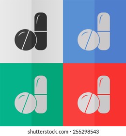 Pills and capsules vector icon. Effect of folded paper. Colored (red, blue, green) illustrations. Flat design
