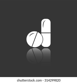 pills and capsules vector icon with mirror reflection