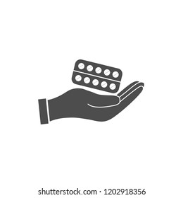 Pills in hand icon. Vector illustration, flat design.