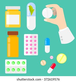 Pills, vitamins and drug medicaments in flat style. Pills, capsules and prescription bottles. Medical icons. Pill in hand.