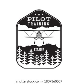 Pilot training academy emblem logo template. Flying school silhouette label with retro biplane. Stock vector isolated