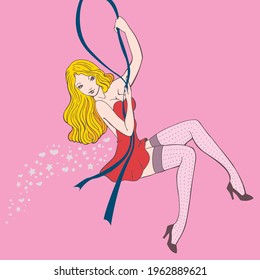 Pin up girl with blonde hair and a red dress swinging while hanging from a ribbon