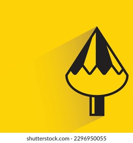 pine tree with shadow on yellow background