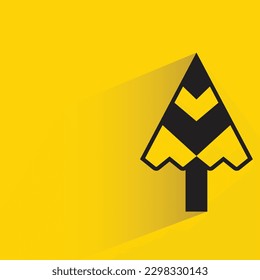 pine tree with shadow on yellow background