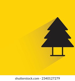 pine tree with shadow on yellow background