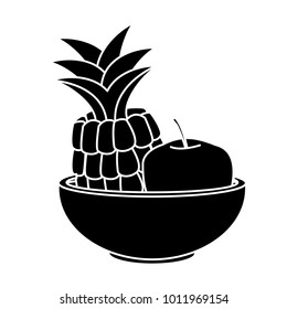 Pineapple and apple on bowl